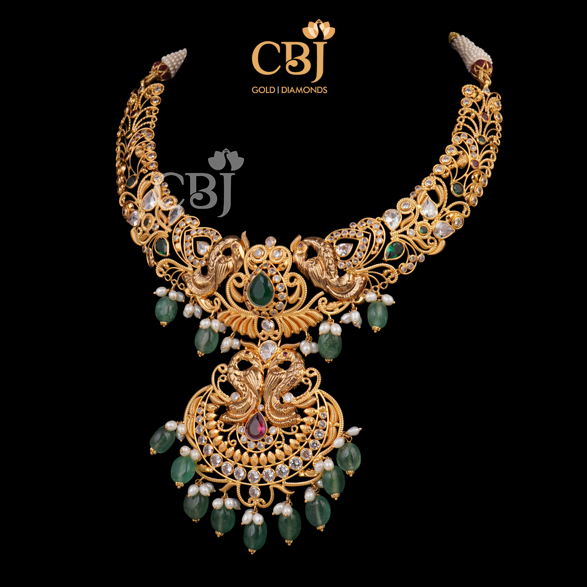 A CZ pachi kante featuring emerald and ruby stones.