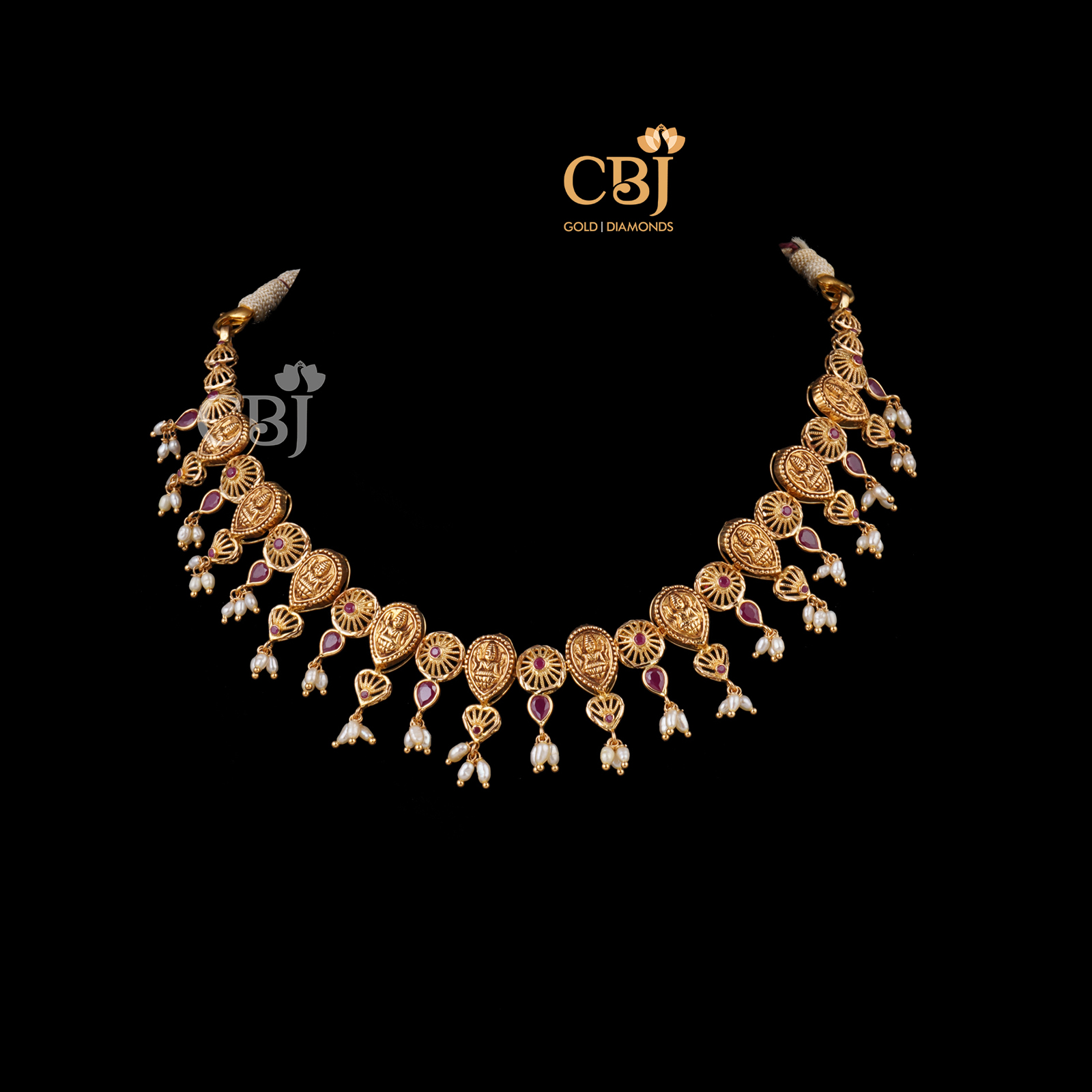 A stunning filigree necklace featuring Lakshmi Kasu.