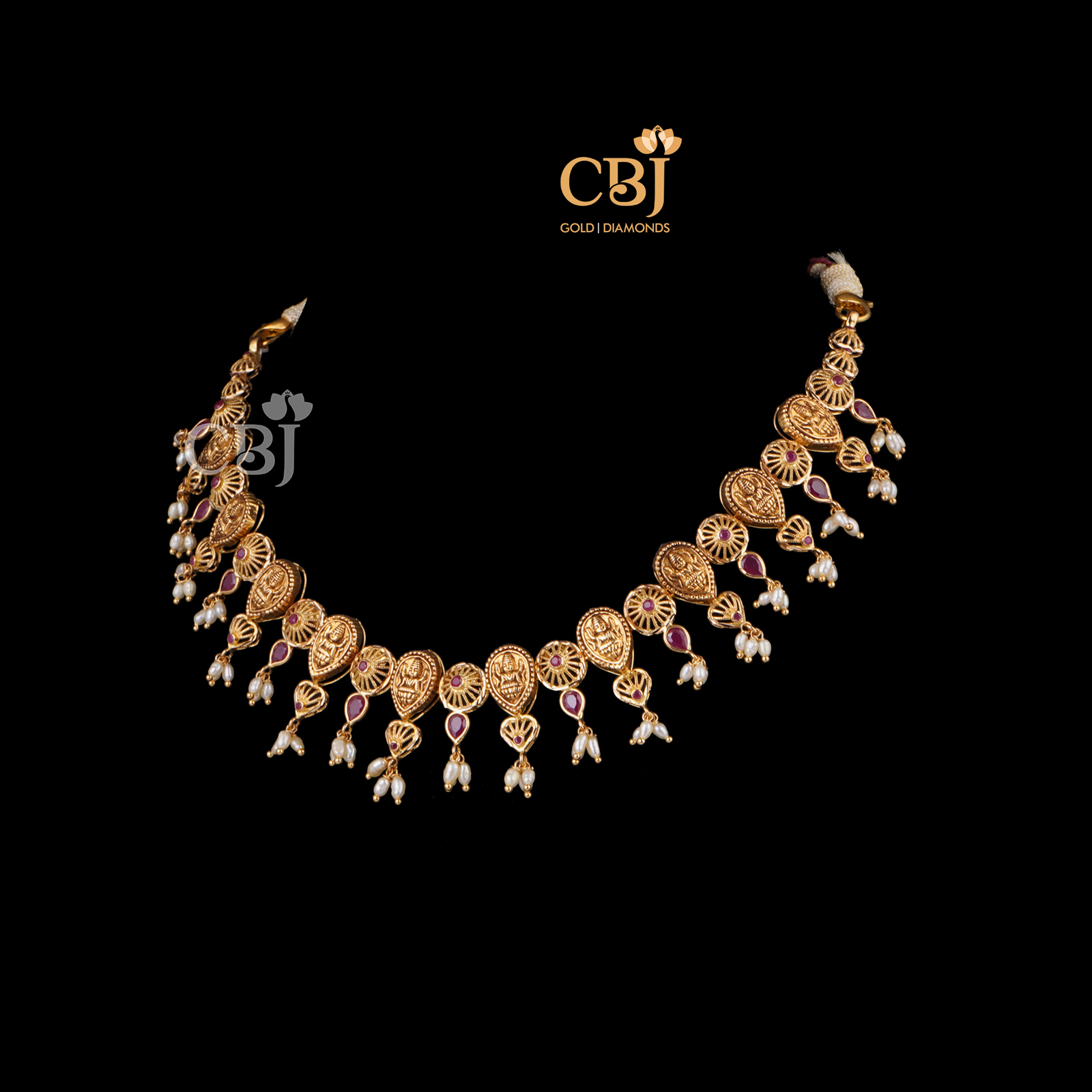 A stunning filigree necklace featuring Lakshmi Kasu.