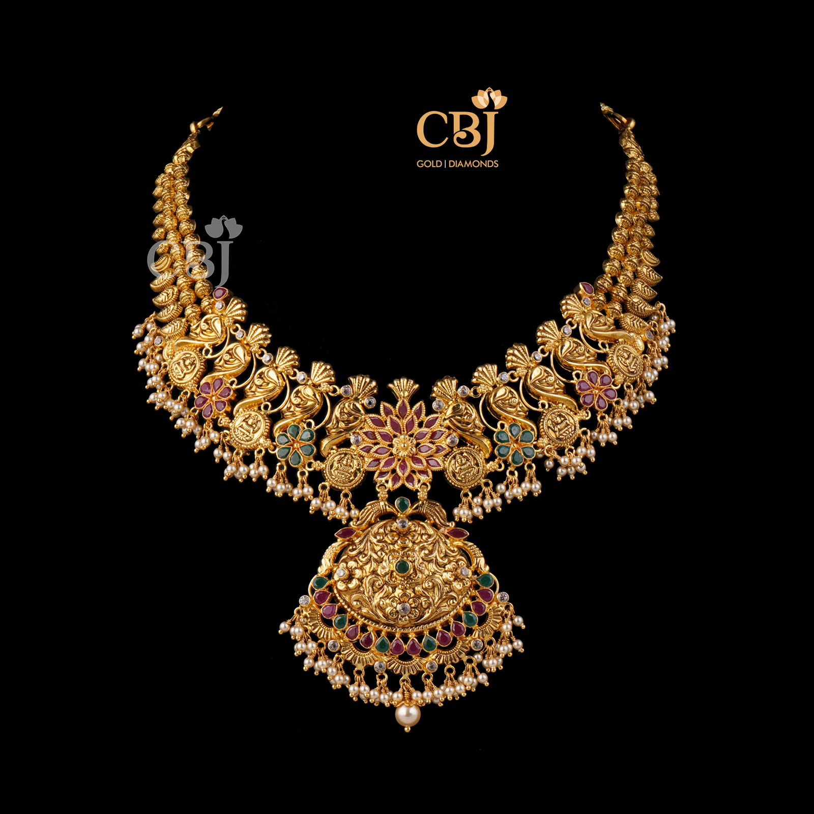 A slick fashionable designer light weight necklace featuring rubies and emeralds.