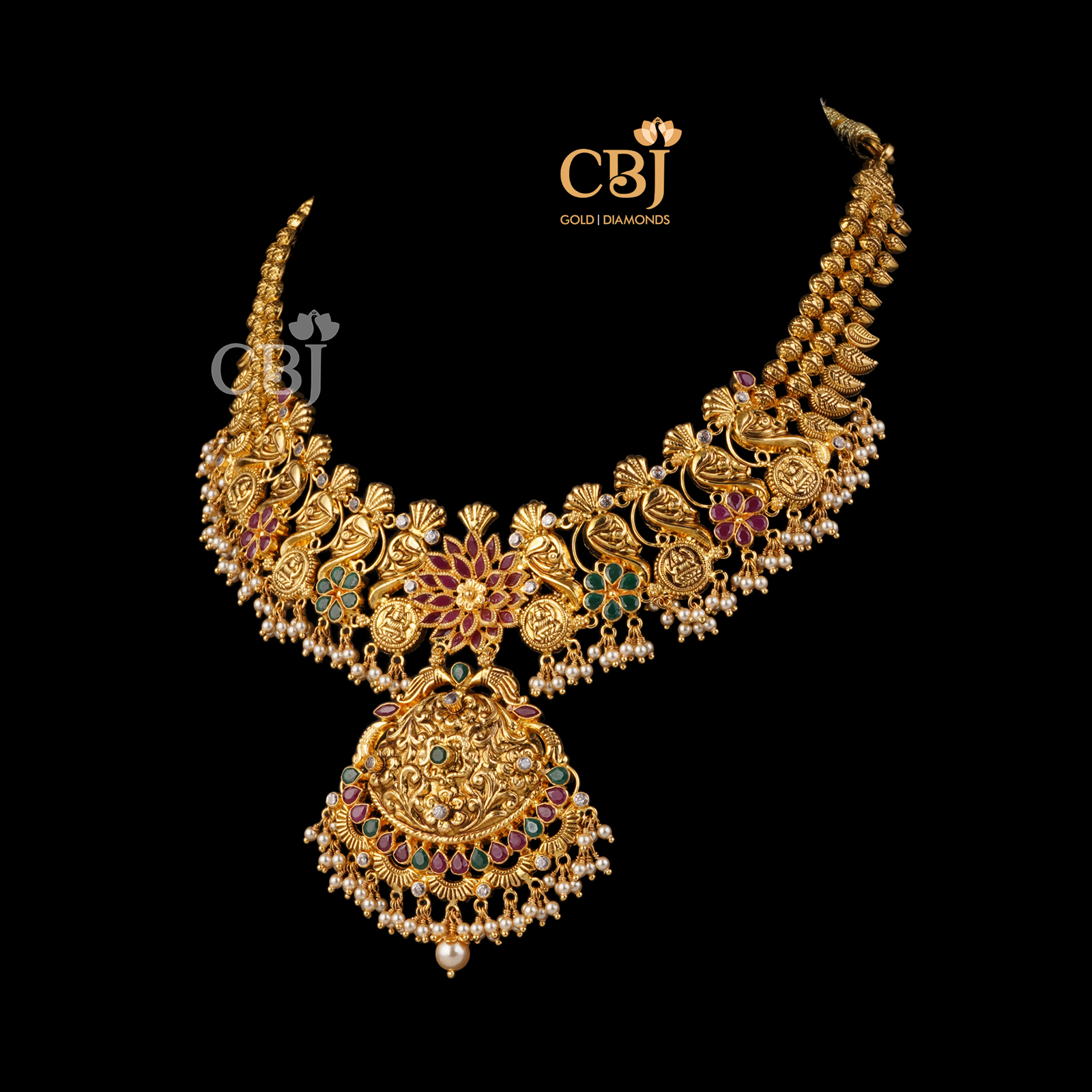 A slick fashionable designer light weight necklace featuring rubies and emeralds.