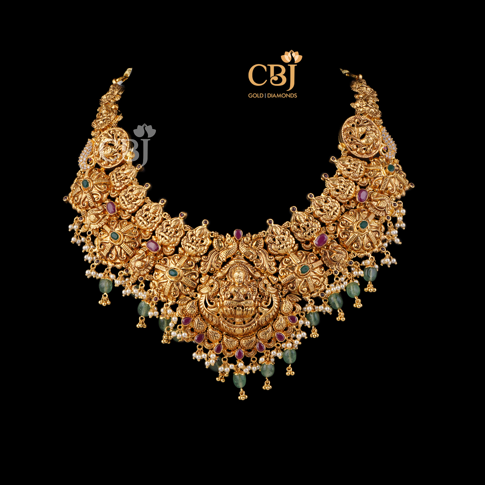 Antique broad necklace featuring rubies and zambian emeralds.