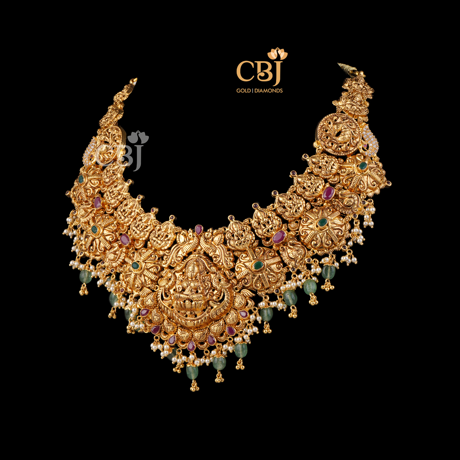 Antique broad necklace featuring rubies and zambian emeralds.