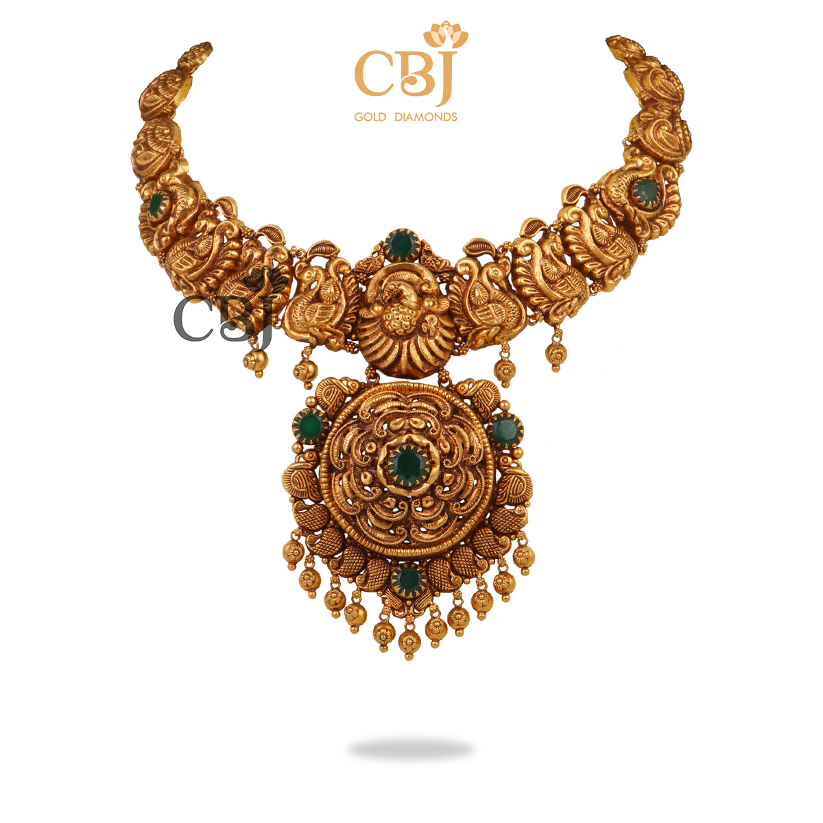Antique nakashi necklace studded with emerald stones, featuring a stunning centrepiece.