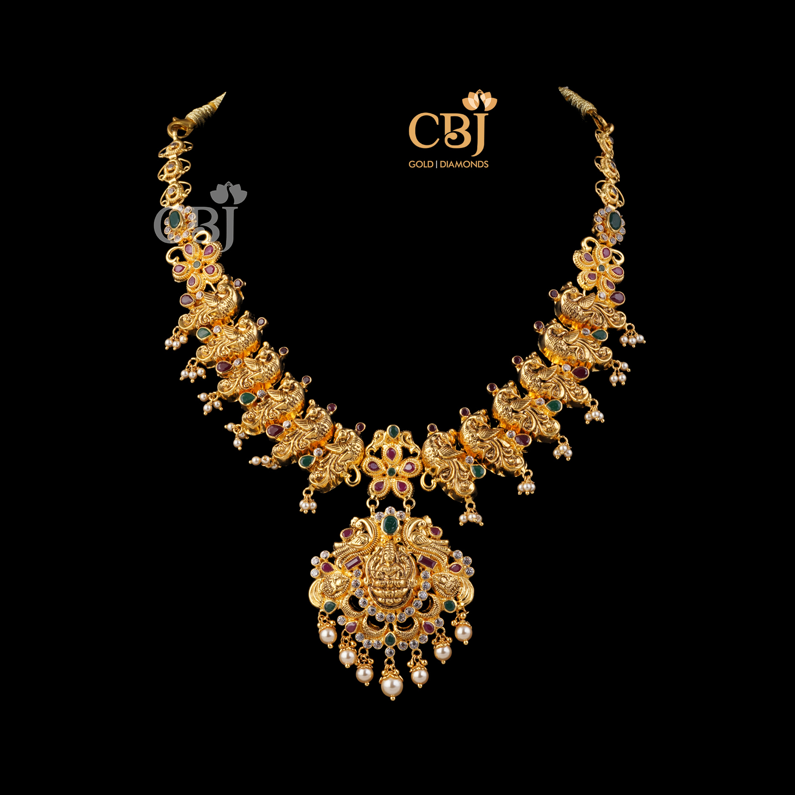 A light weight necklace featuring ruby, emerald and pearls.