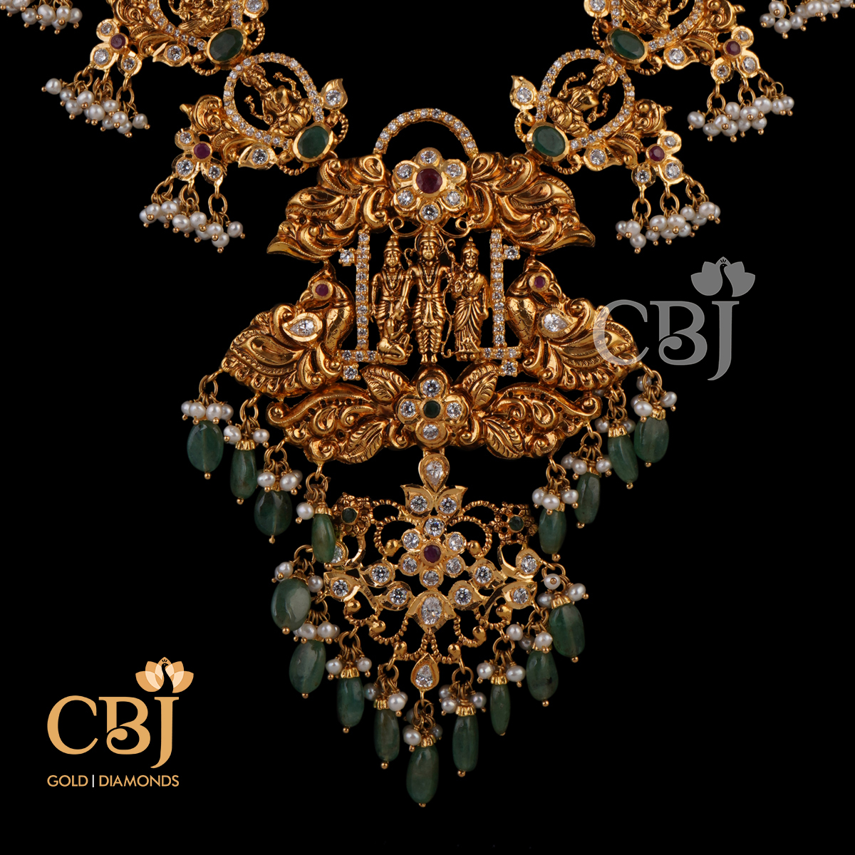 Unique CZ pachi Ramparivar necklace featuring emerald and pearl drops.