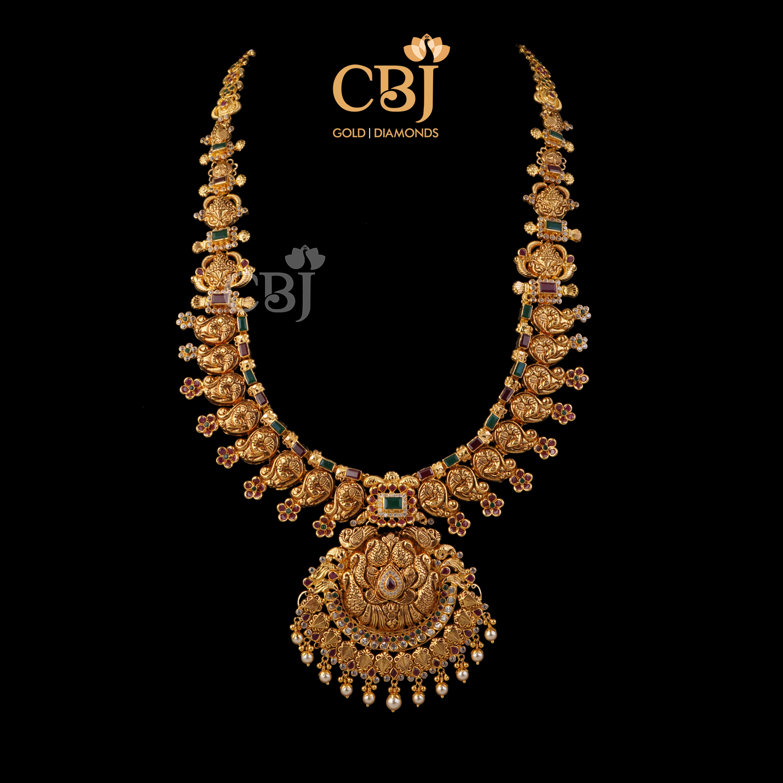 A stunning U haram featuring ruby and emerald stones.