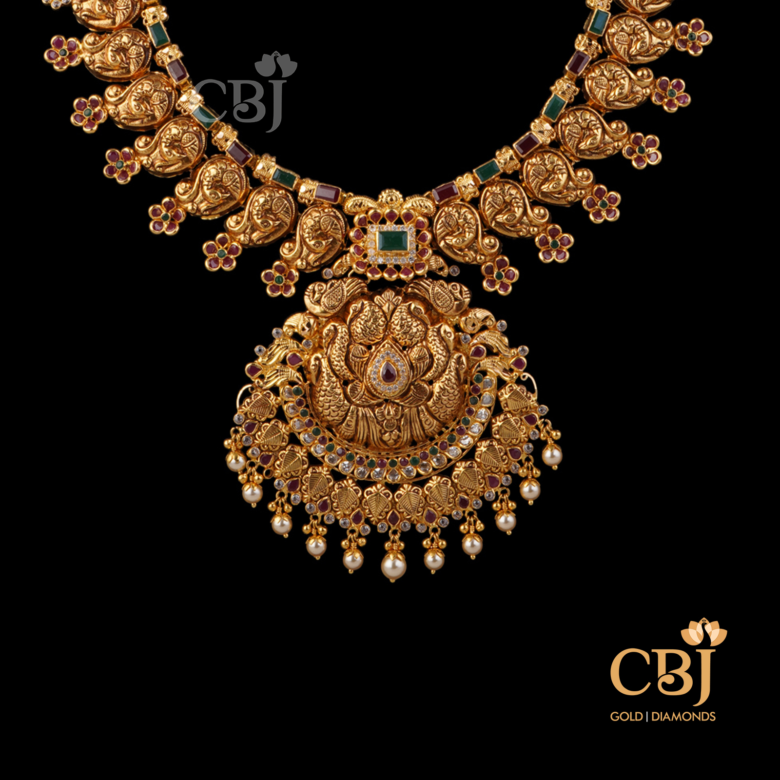 A stunning U haram featuring ruby and emerald stones.