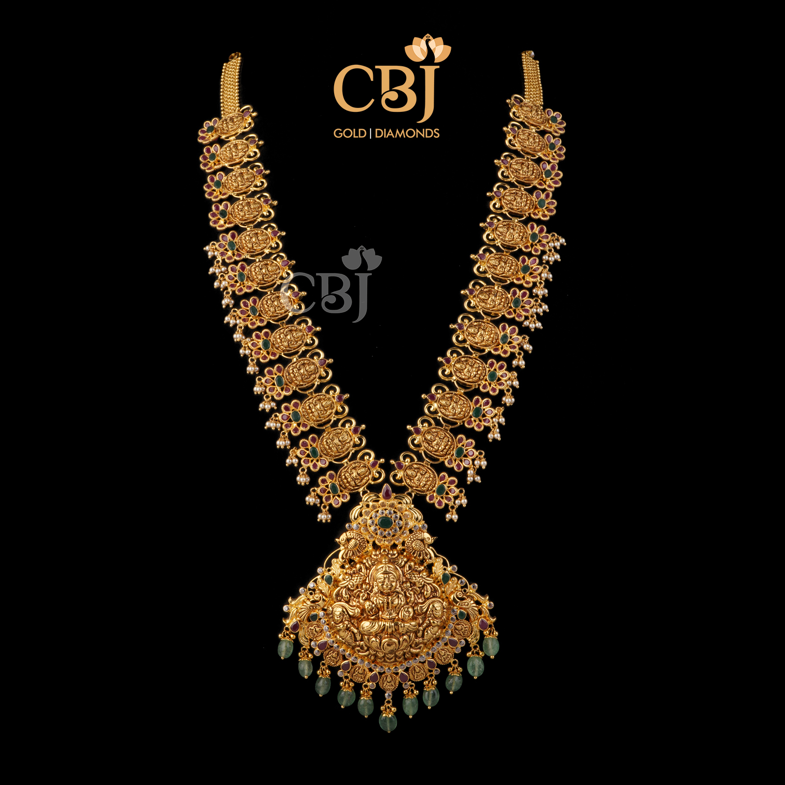 A bridal ruby emerald haram featuring zambian stones.