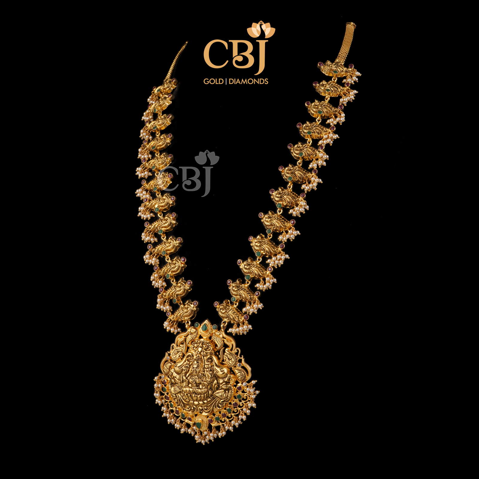 A light weight ruby emerald haram featuring divine motifs.