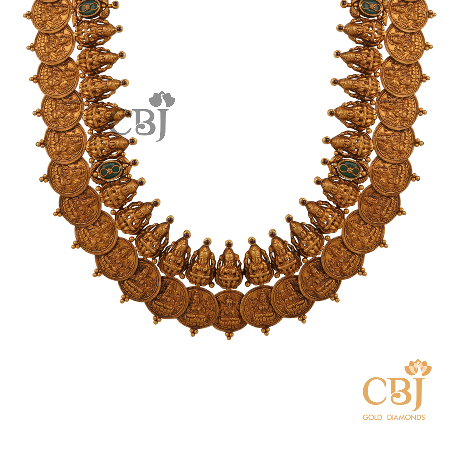 An antique kasumala with a rich finish studded with emerald stones.