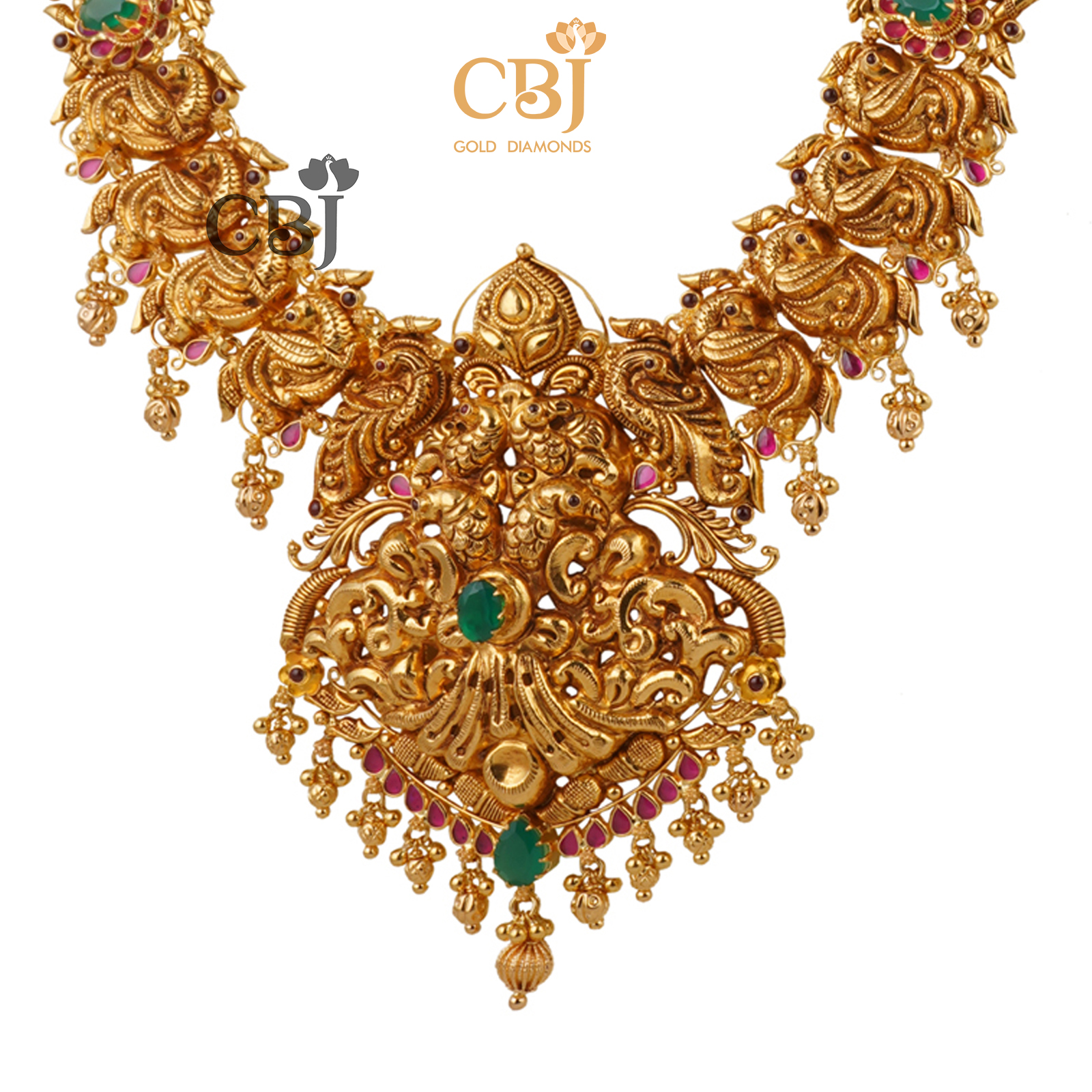 A simple light weight antique nakashi haram decorated with ruby and emerald stones.
