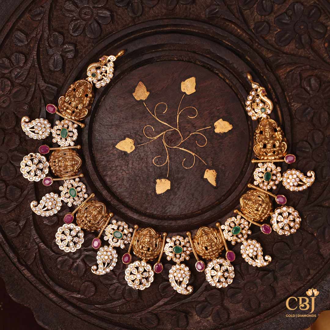 A mystical design featuring an array of stones like CZs, rubies and emeralds. A short necklace that is worth every glimpse!