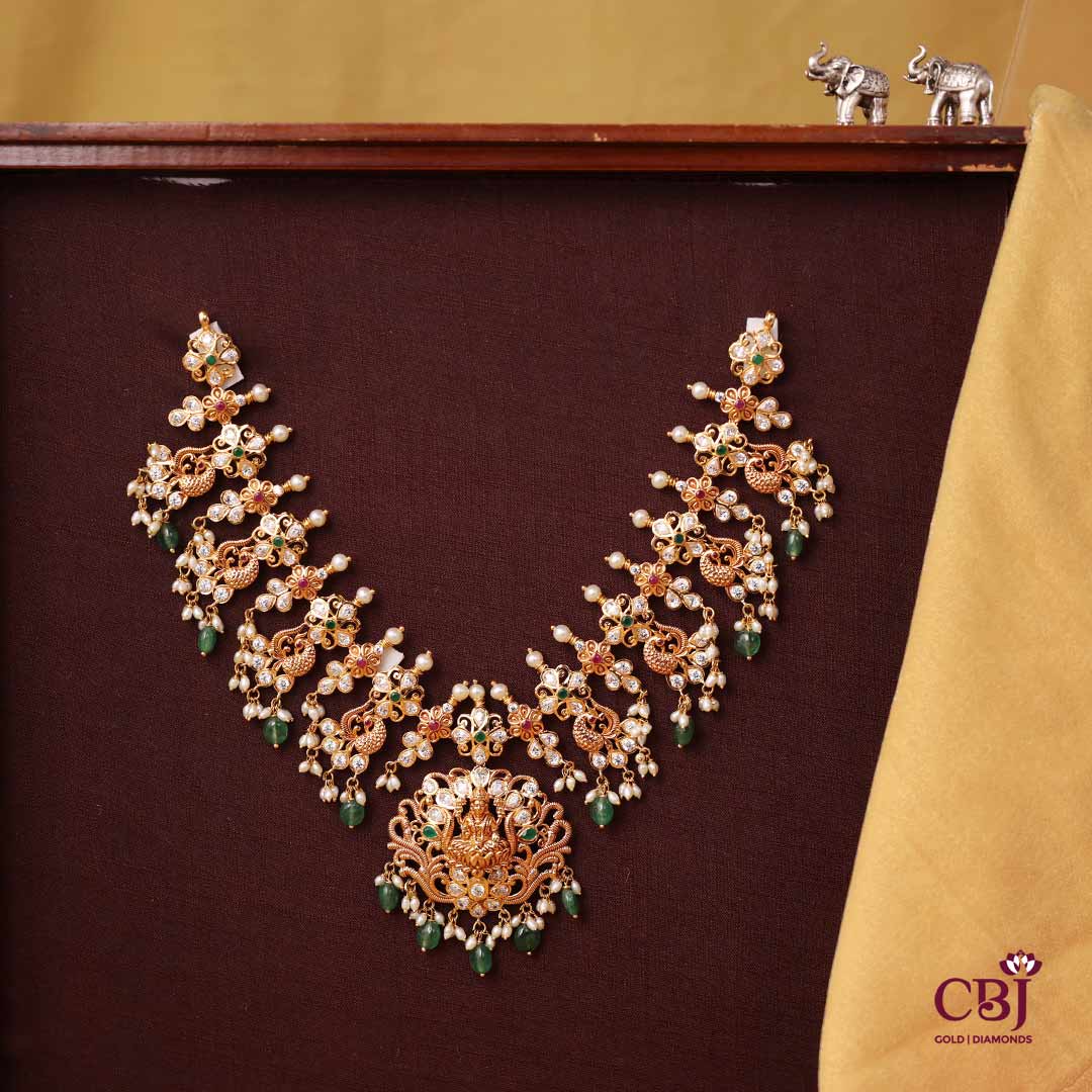 Rich floral design decorated with CZs, rubies, emeralds and pearls. Traditional yet timeless.