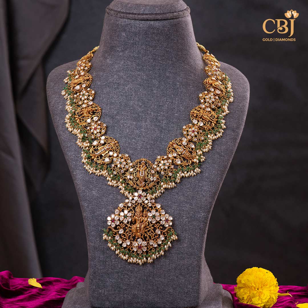 Unlock the magic of divine tradition with this exquisite Dashavataram haram adorned in micro-pearls. Let it take you to new heights of elegance.