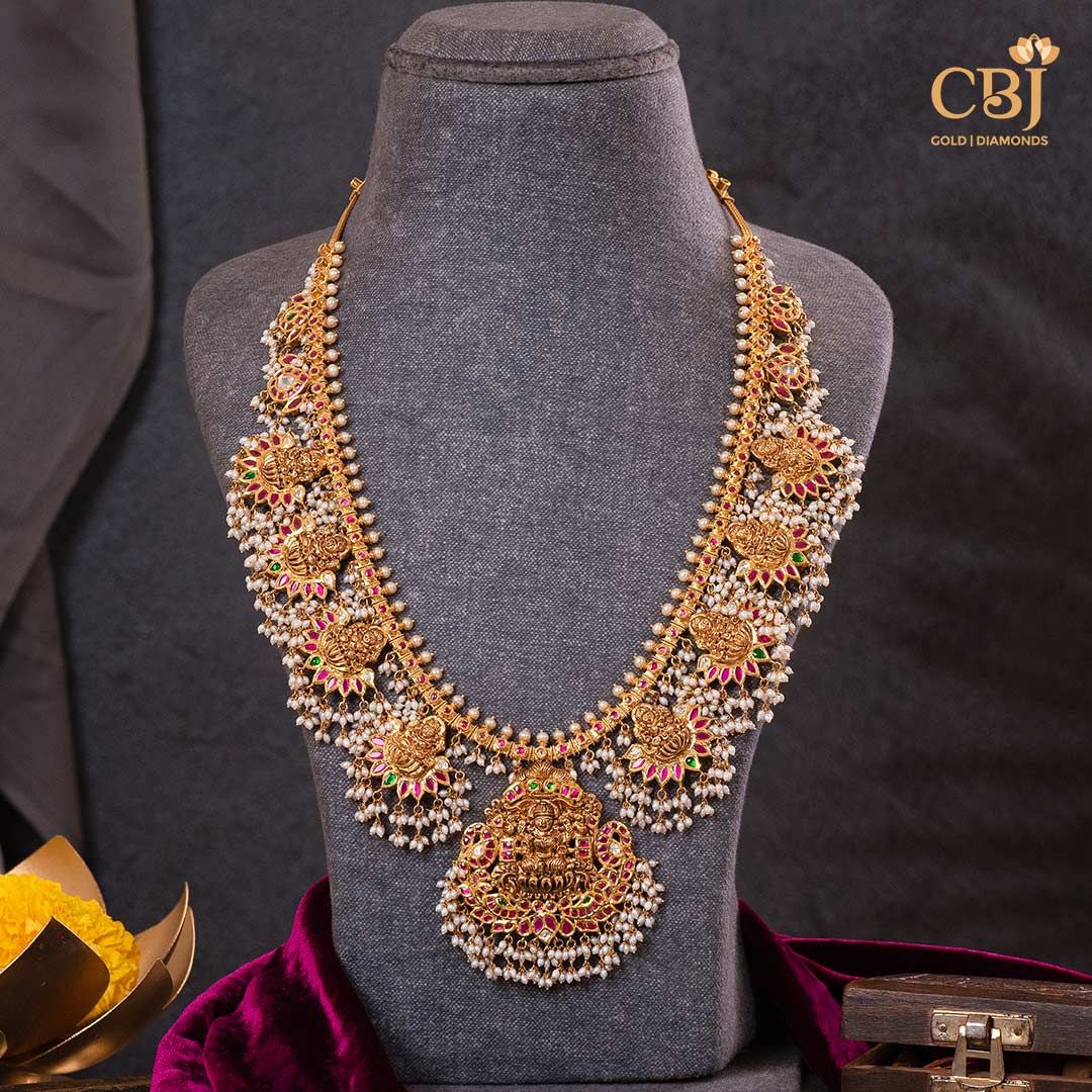 Adorn yourself with the grace of goddess Lakshmi with our CZ Pachi Lakshmi Gutta Pusalu necklace.