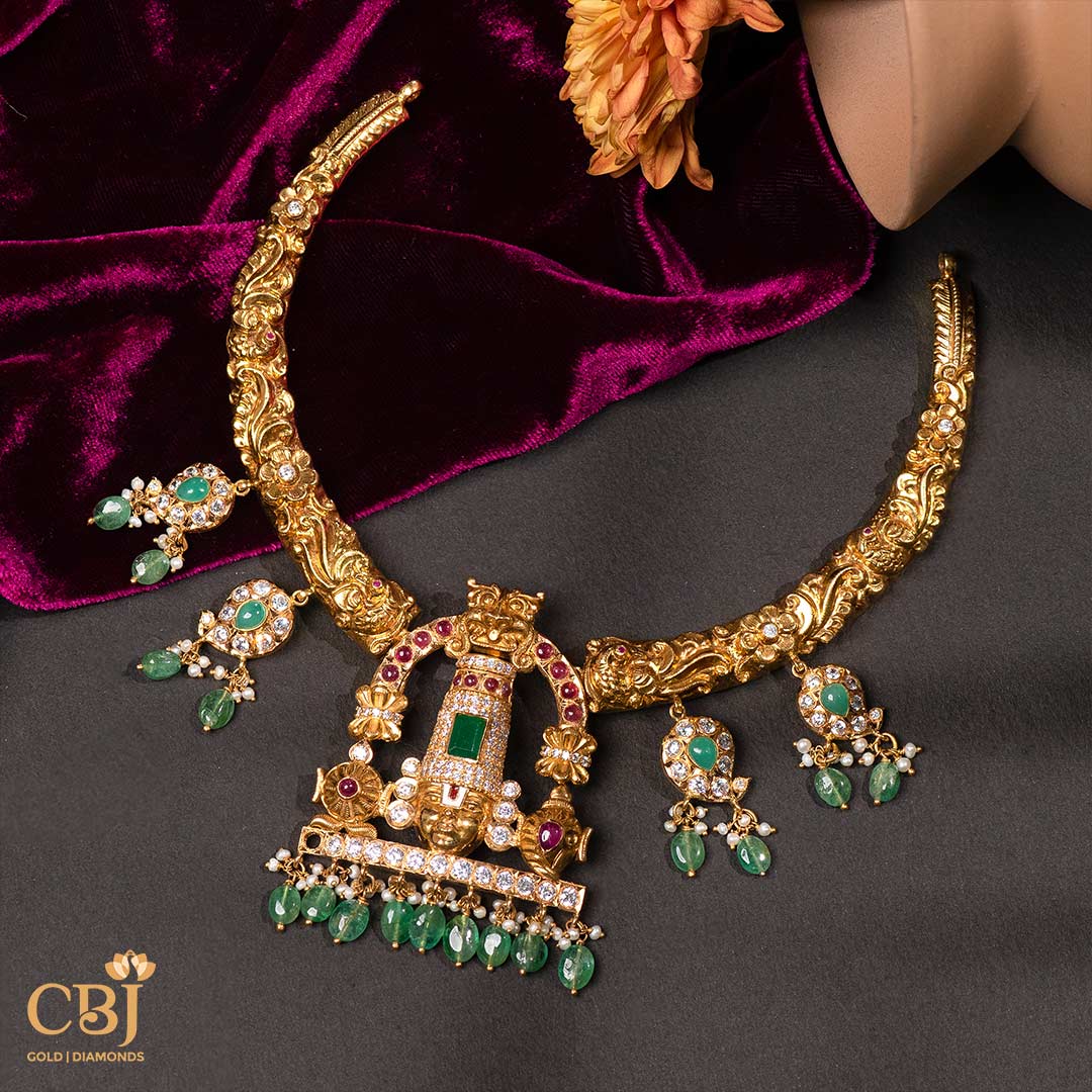 Adorn yourself with the glory of Lord Balaji and the magnificence of emerald drops with our CZ pachi Kante.