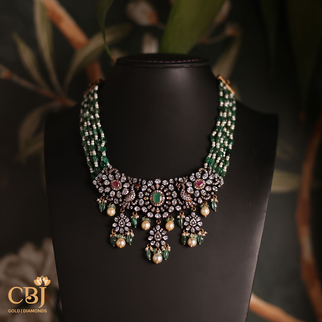 Be swept away by the timeless beauty of this beaded Victorian necklace embellished with emeralds, pearls and CZ’s.