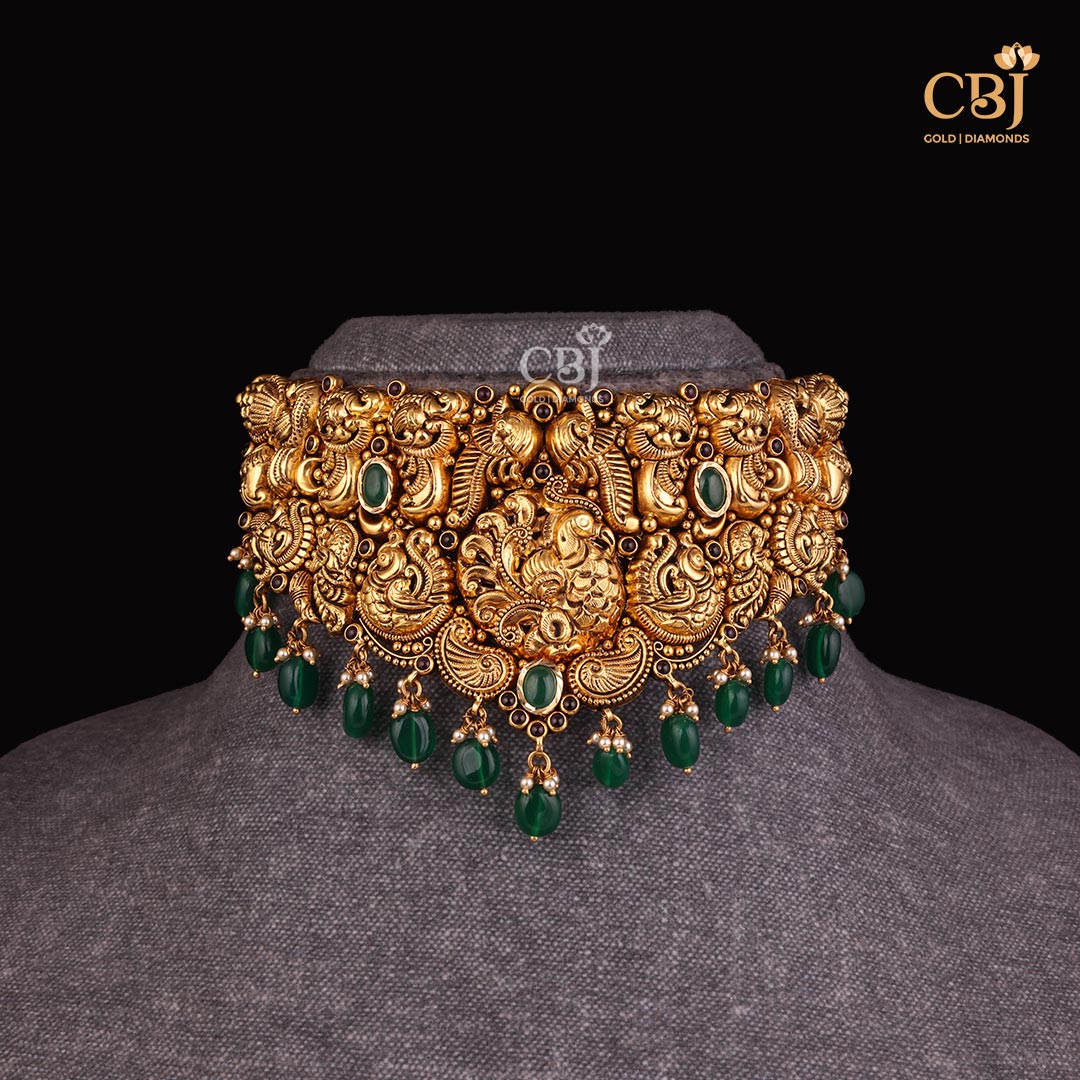 Embrace the Charm of fine craftsmanship with this majestic antique choker featuring emerald stones.