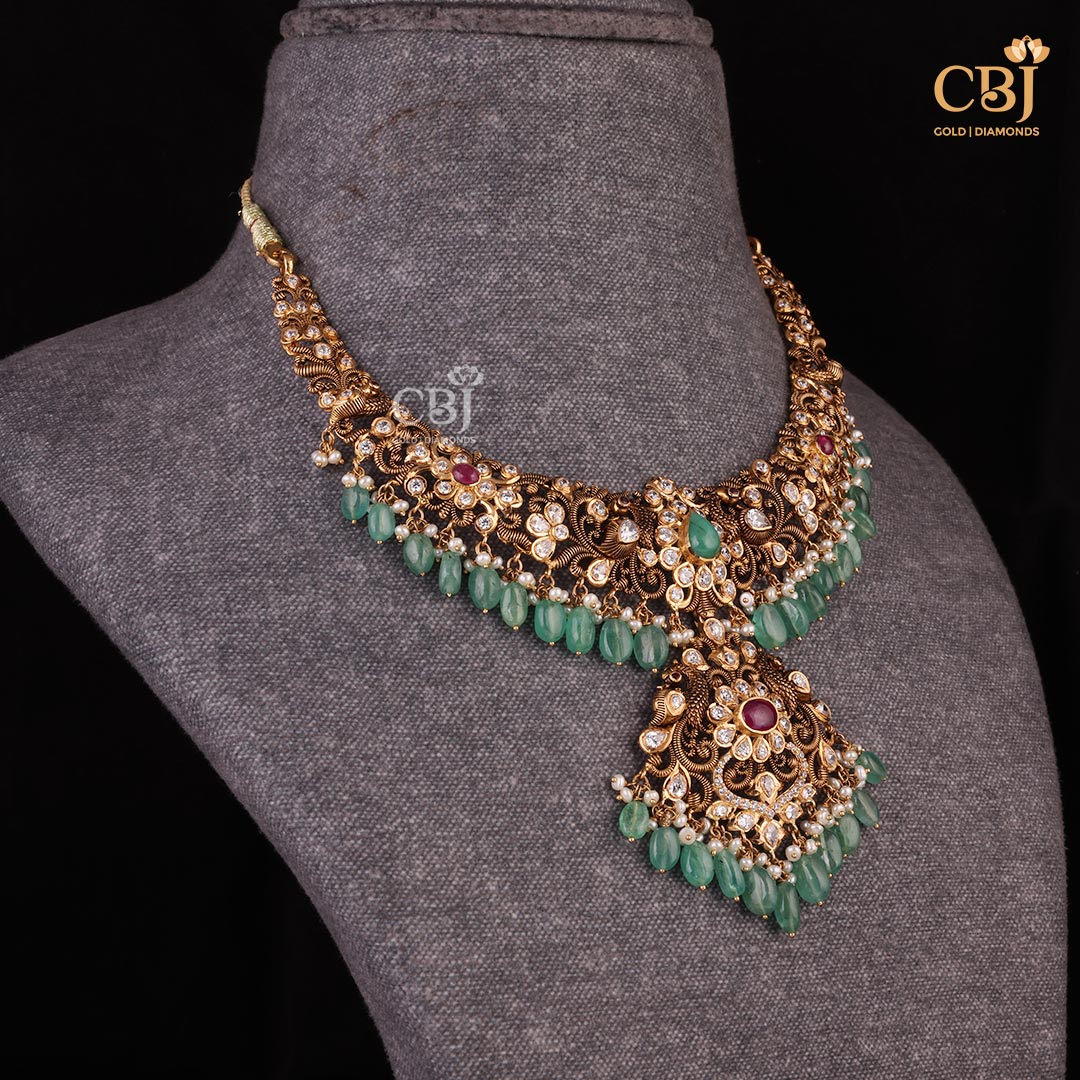 Experience the Legacy of Pachi Craftsmanship with this short necklace featuring peacock ???? motifs decorated with CZs
