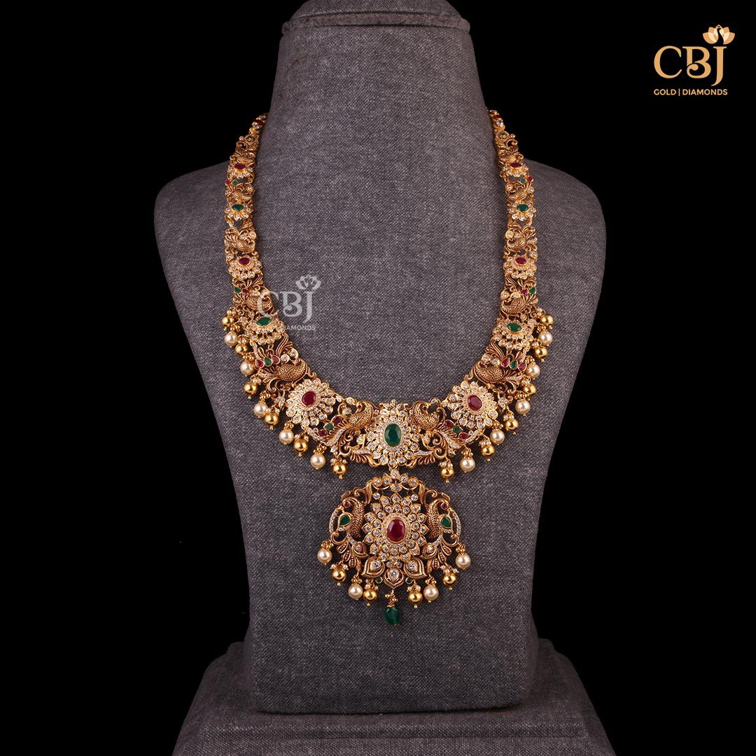 Captivating Elegance, Timeless Appeal..  A stunning Pachi necklace embossed with CZs, pearls, rubies and emeralds.