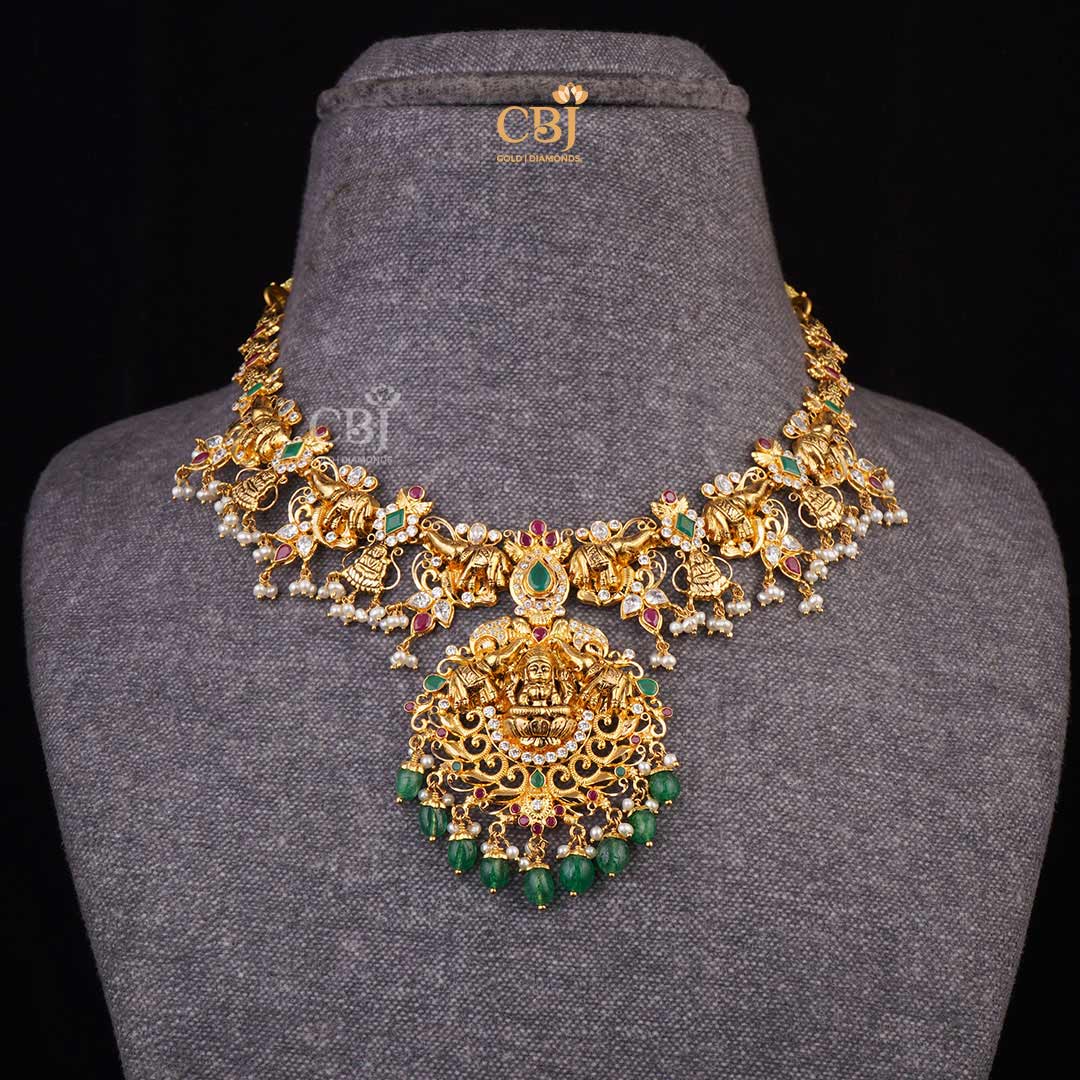 Sacred Charm: CZ Pachi Lakshmi Short Necklace combining Rubies, Emeralds, and PearlsSacred Charm: CZ Pachi Lakshmi Short Necklace combining Rubies, Emeralds, and Pearls