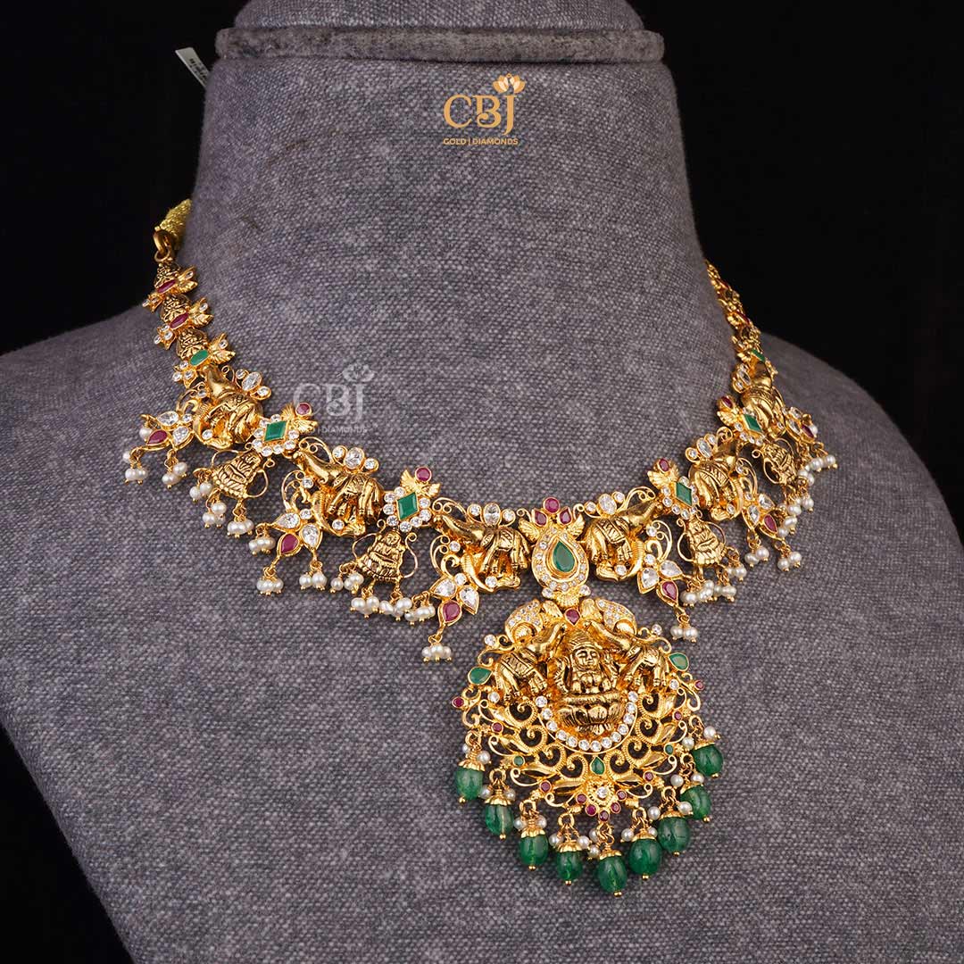 Sacred Charm: CZ Pachi Lakshmi Short Necklace combining Rubies