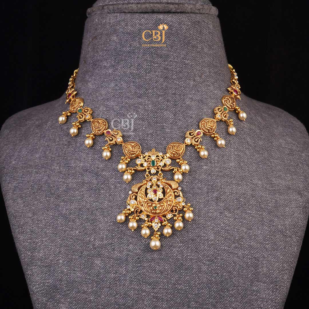 Captivating Charm: CZs, Pearls, Emeralds, and a Moon shaped Centerpiece enhance this Short Light Weight Necklace