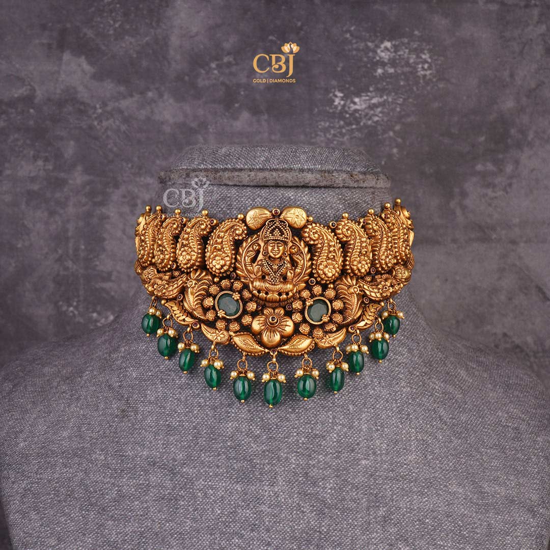 Jewels of Heritage: Antique Lakshmi Choker featuring Exquisite Emerald Stones