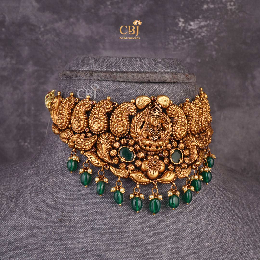 Jewels of Heritage: Antique Lakshmi Choker featuring Exquisite Emerald Stones