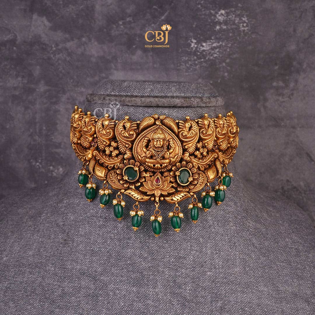 Captivating Aura: Antique Lakshmi Choker adorned with Mesmerizing Emerald Stones