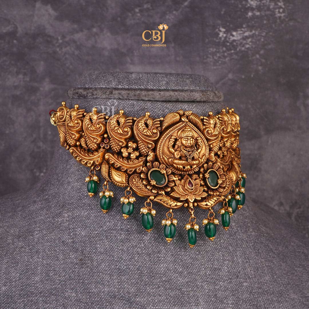 Captivating Aura: Antique Lakshmi Choker adorned with Mesmerizing Emerald Stones