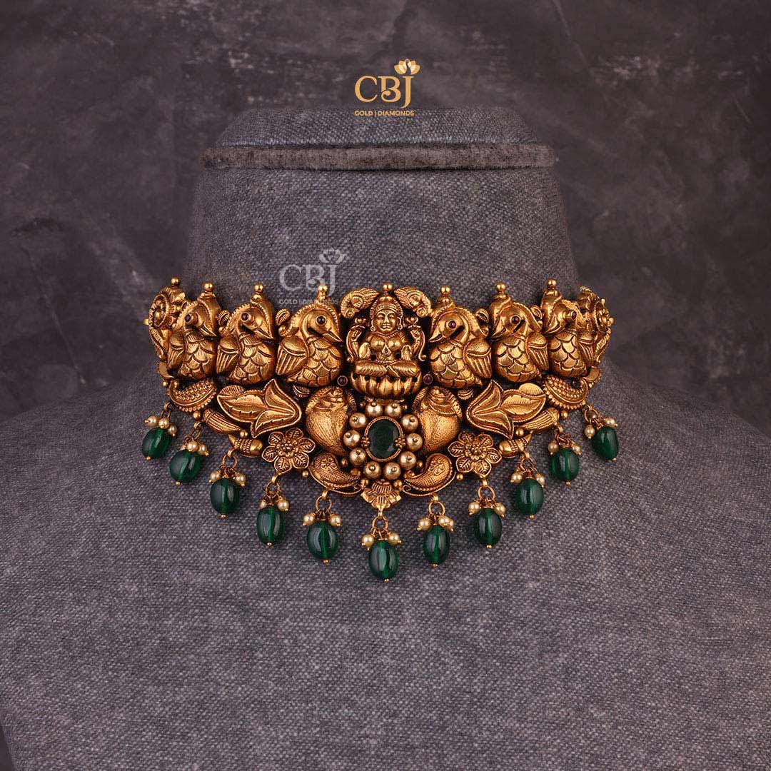 Lakshmi Choker with swan motifs decorated with rubies, emeralds and pearls.