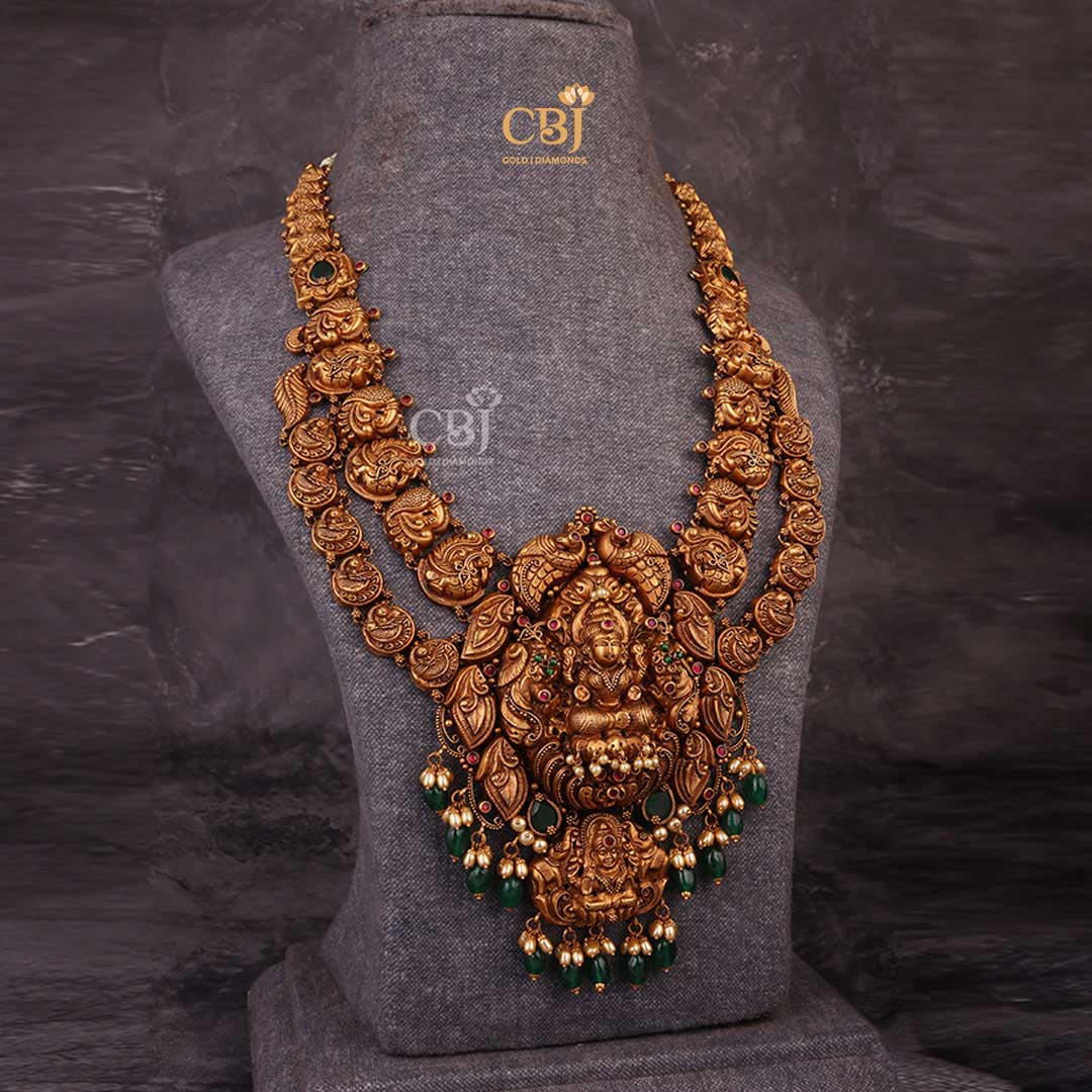 Goddess of Wealth: Embrace the Aura of Lakshmi with this Antique Long Haram embellished with Emerald Drops.
