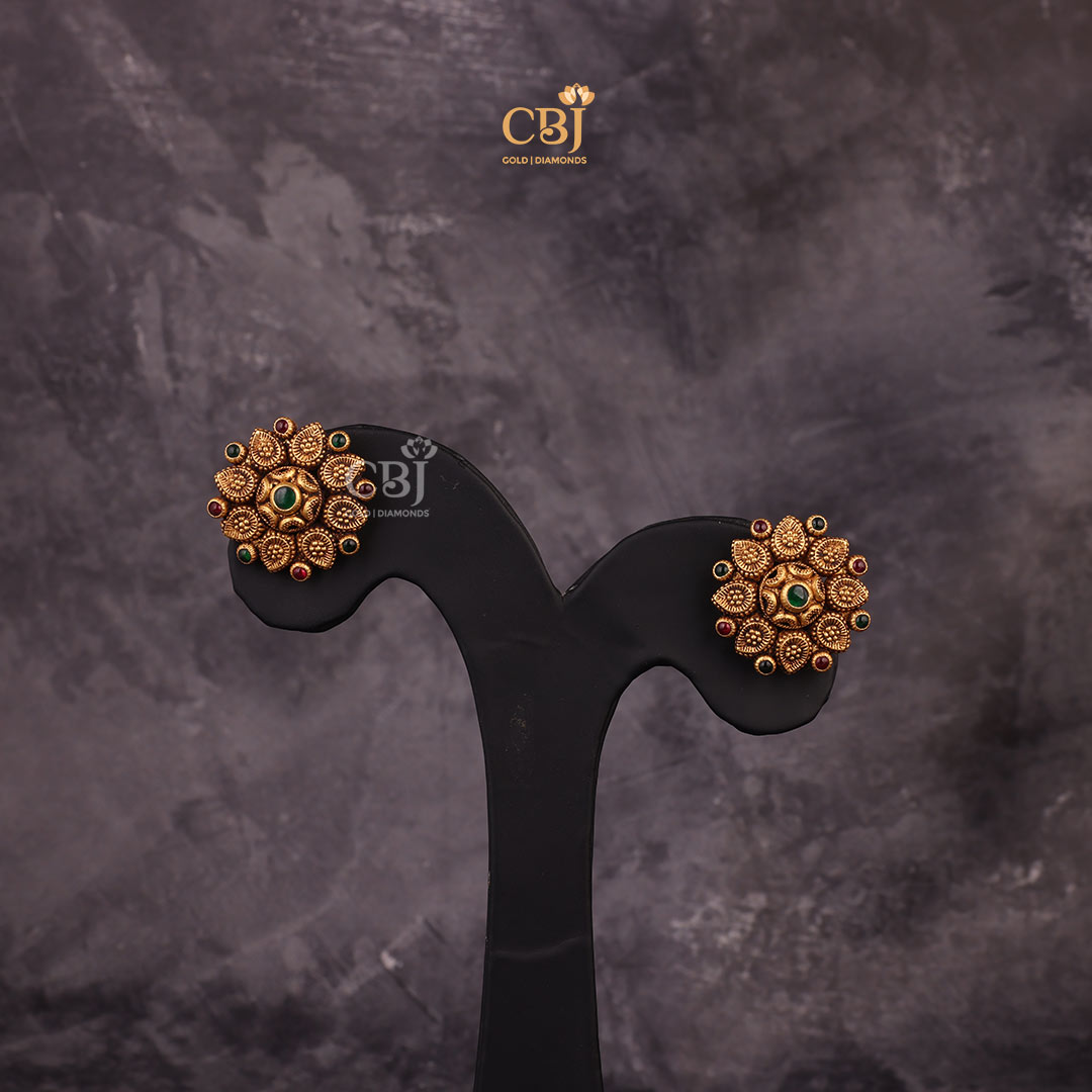 Embrace Timeless Beauty with these Temple Design Antique Studs decorated with Ruby and Emerald Potas.