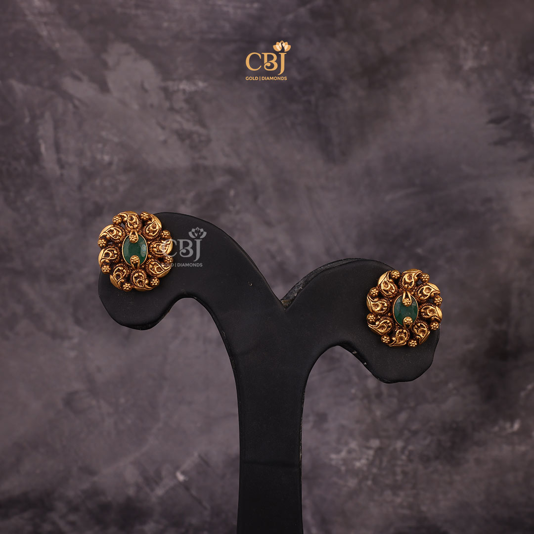 Adorn Your Ears with these Exquisite Pair of  Antique Nakashi Studs featuring Mango Motifs.
