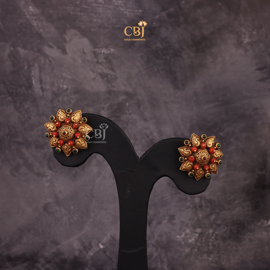 A star shaped antique coral stud for a star-studded event.