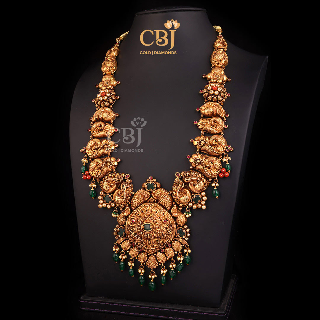 An opulent long antique haram featuring corals