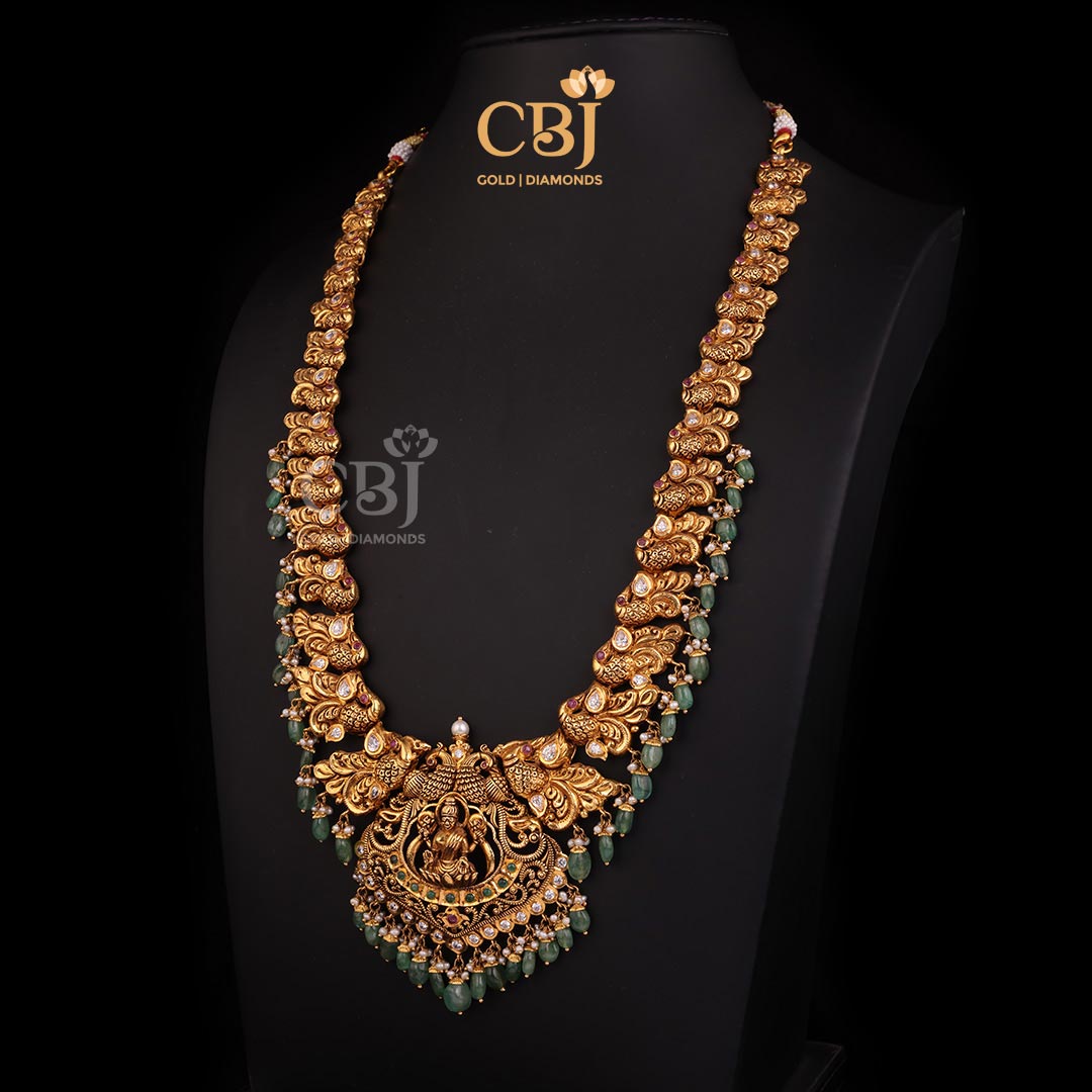 An artistic Lakshmi long haram featuring an antique finish.