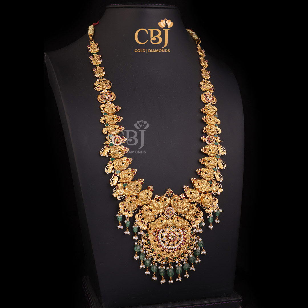 A majestic CZ pachi light weight long haram featuring peacock motifs.