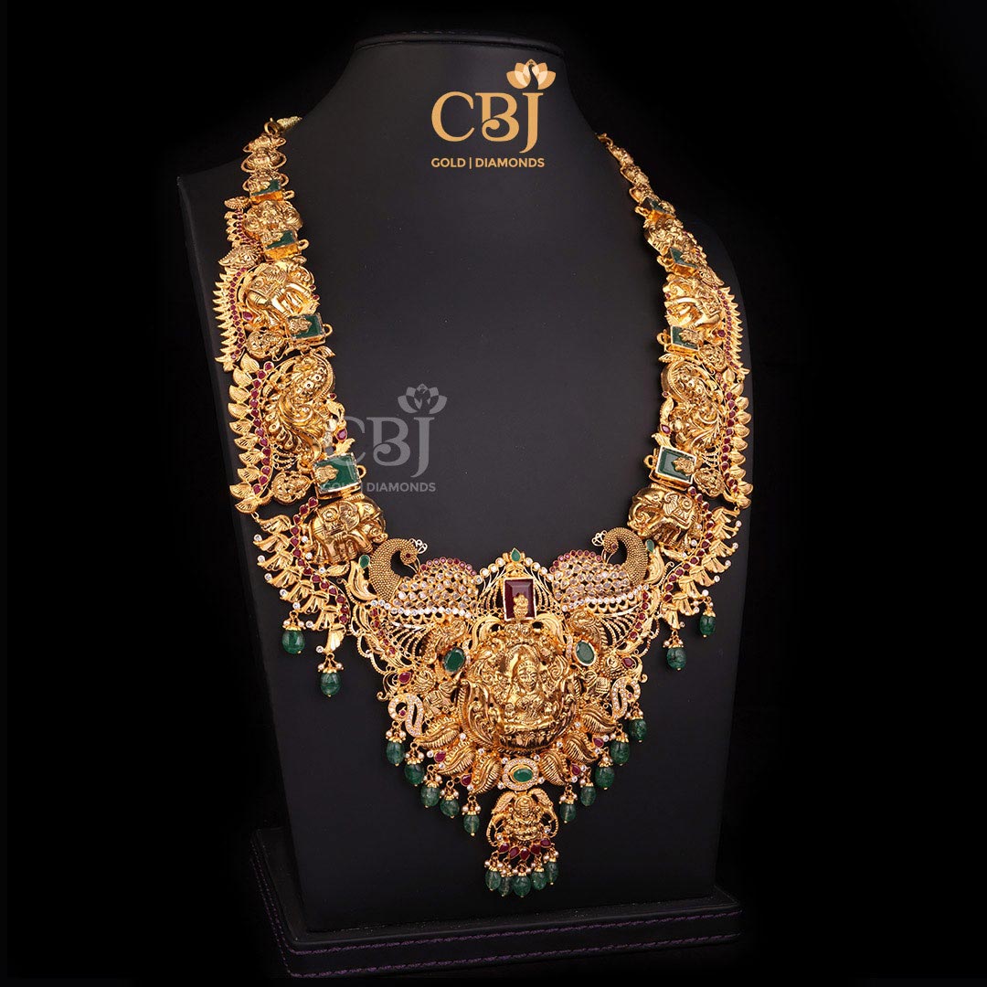 An opulent CZ Pachi Lakshmi light weight haram featuring rubies