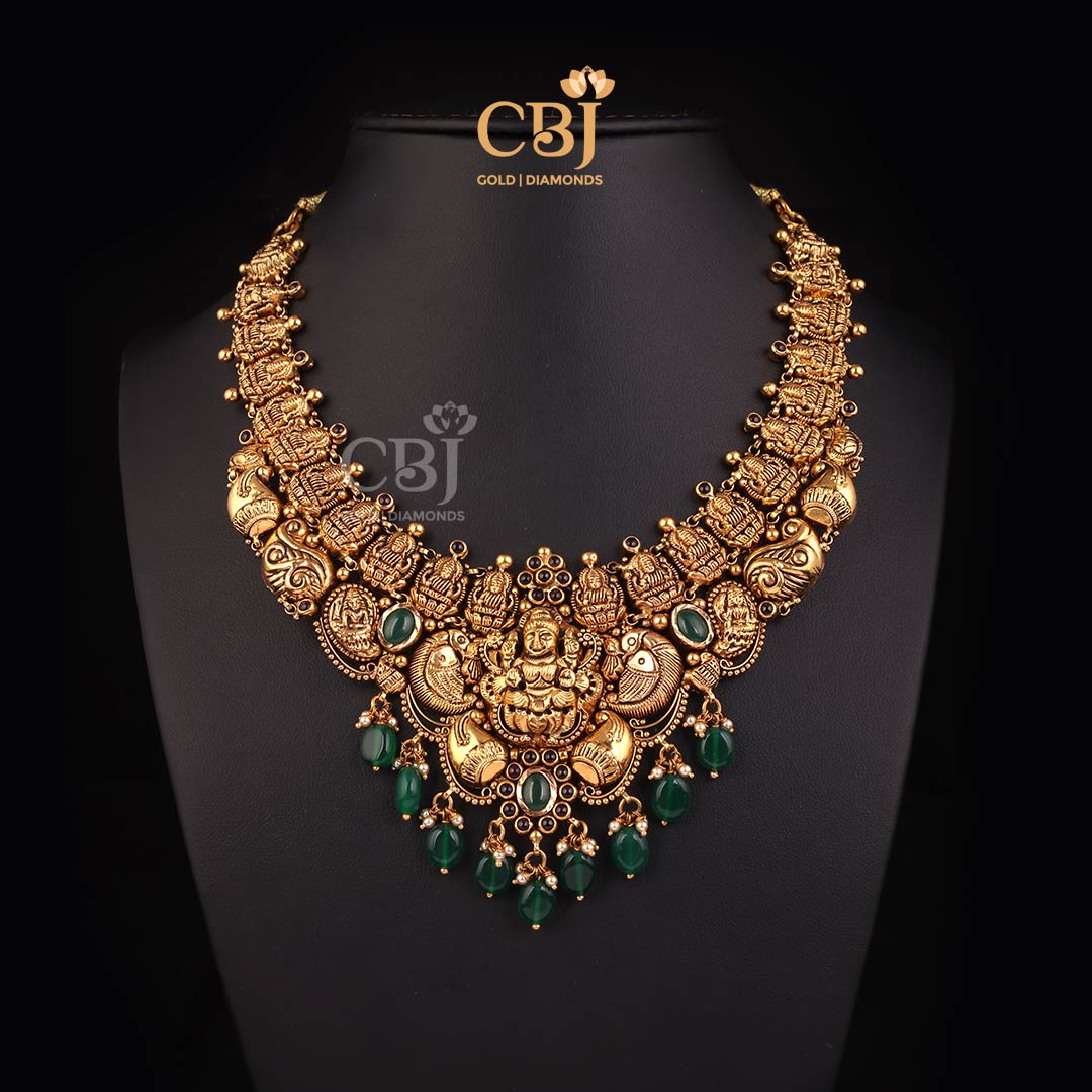 A mesmerising antique Lakshmi short necklace featuring pearls and emeralds.