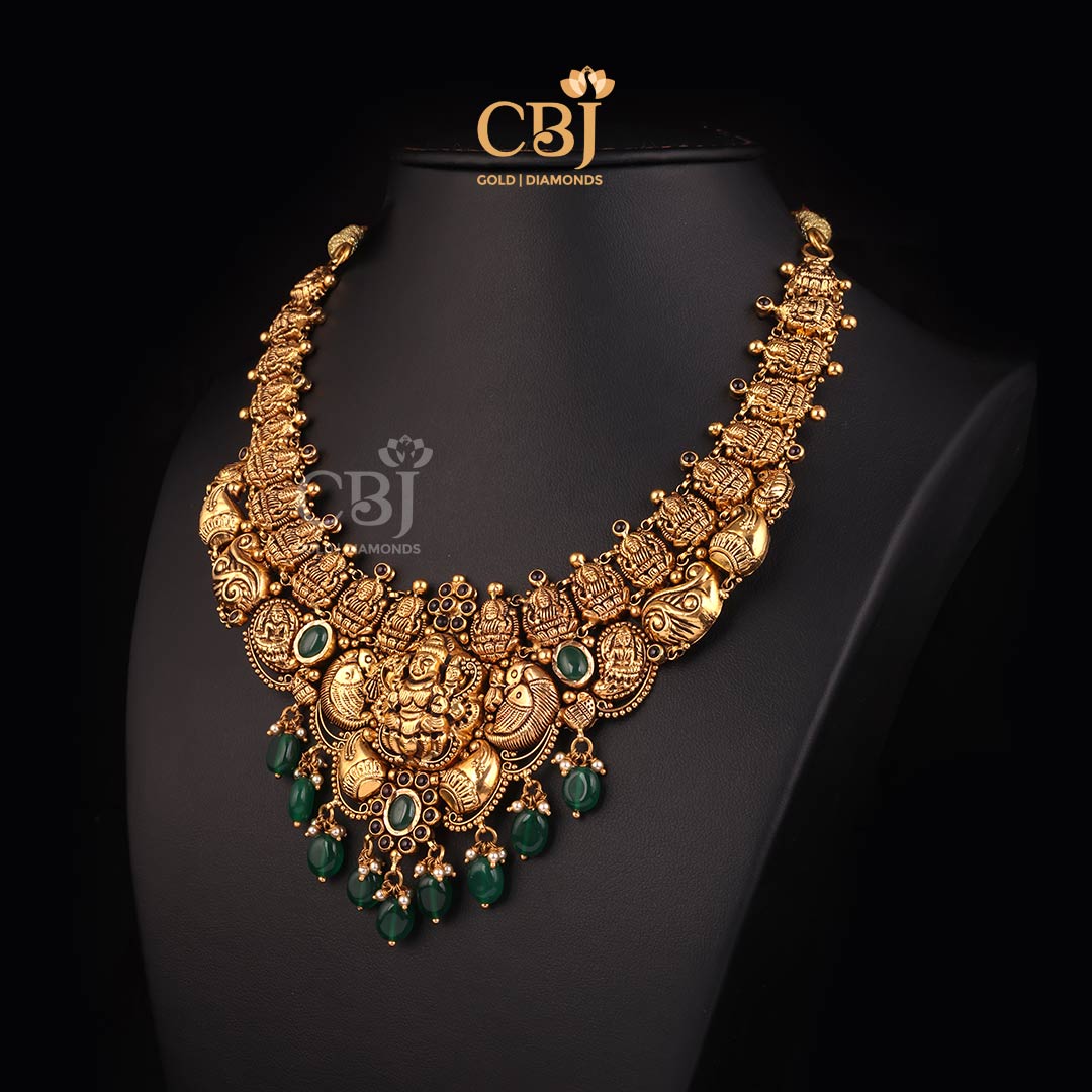 A mesmerising antique Lakshmi short necklace featuring pearls and emeralds.