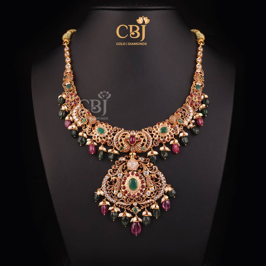 A charismatic CZ Pachi kante decorated with rubies and emeralds.