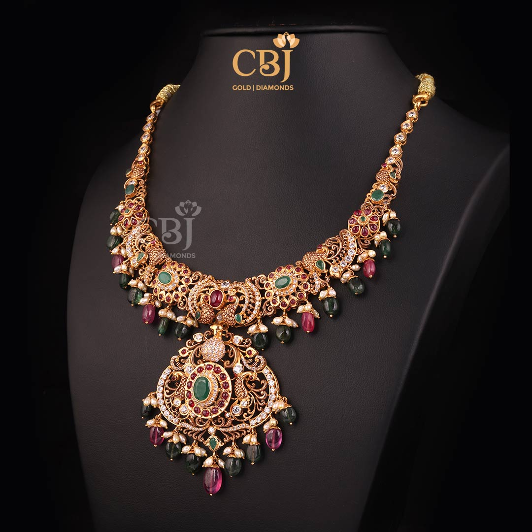 A charismatic CZ Pachi kante decorated with rubies and emeralds.