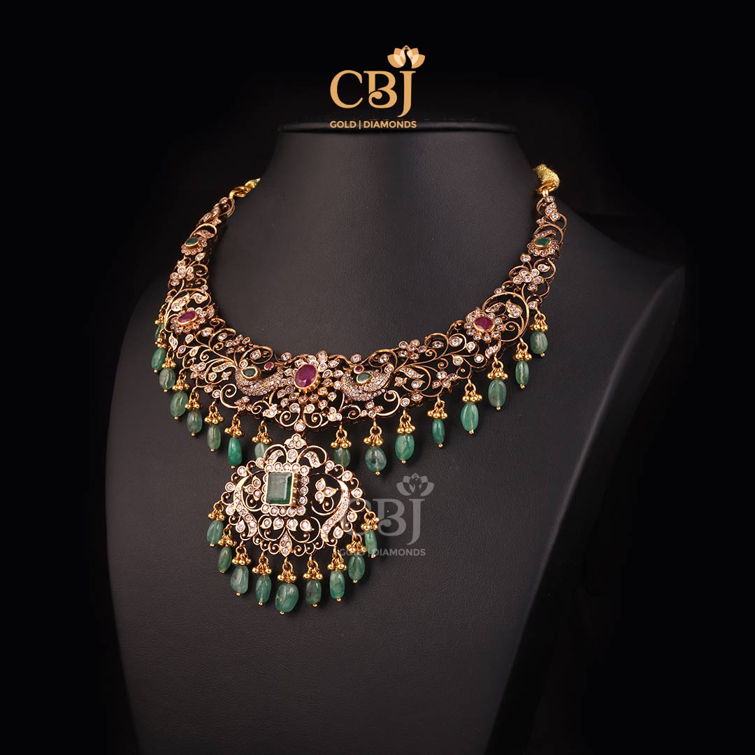 A lustrous CZ pachi necklace adorned with emerald beads.