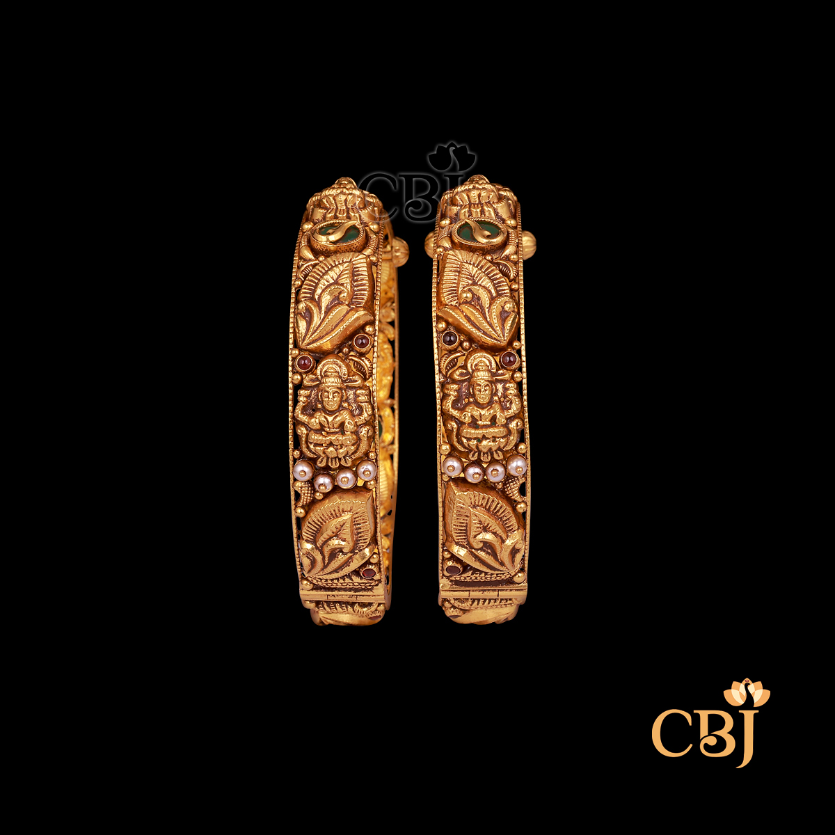 38 grams antique gold bangles set with traditional pattern work and a rich antique finish.