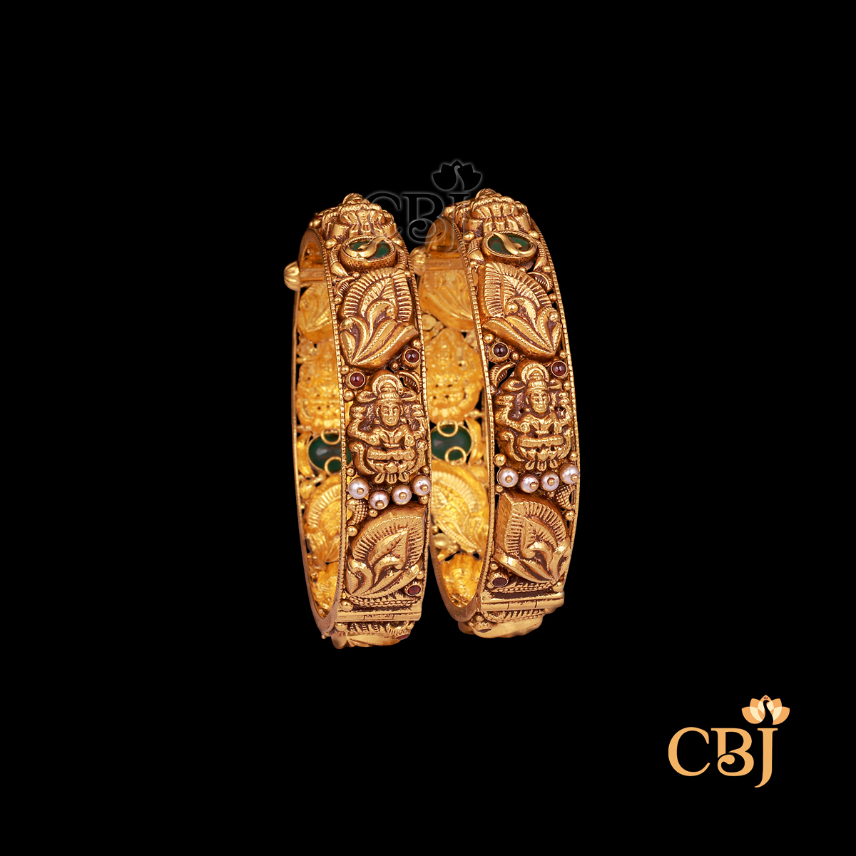 38 grams antique gold bangles set with traditional pattern work and a rich antique finish.