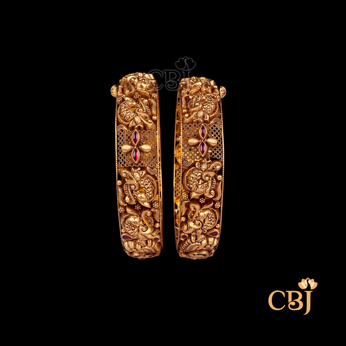 36 grams Nakshi Antique Bangles displayed as a pair of gold bangles with detailed Nakshi carvings, antique finish, and rounded wrist shape.