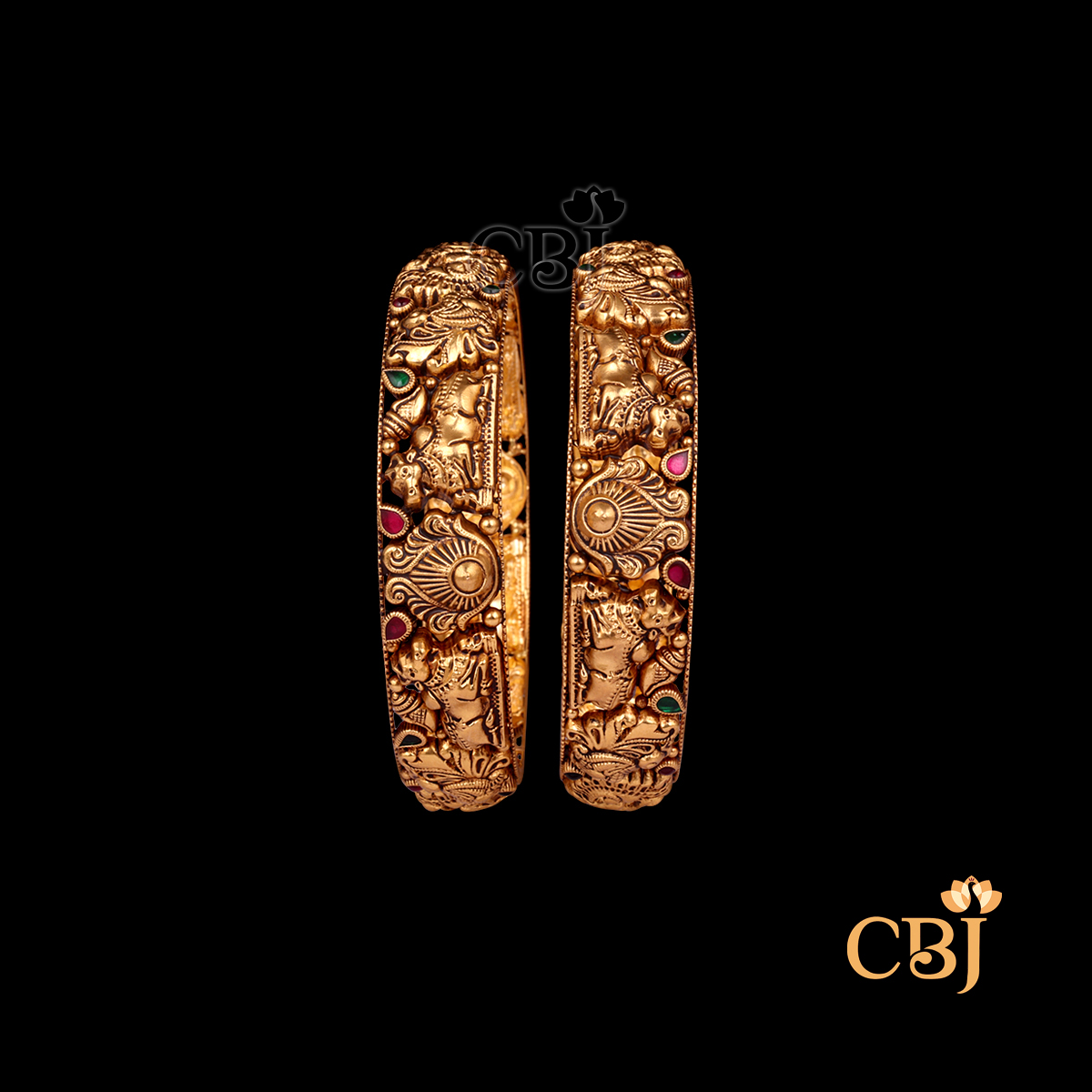 29 grams Nakshi Antique Bangles displayed as a pair of gold bangles with carved Nakshi patterns, antique texture, and a smooth circular wrist fit.